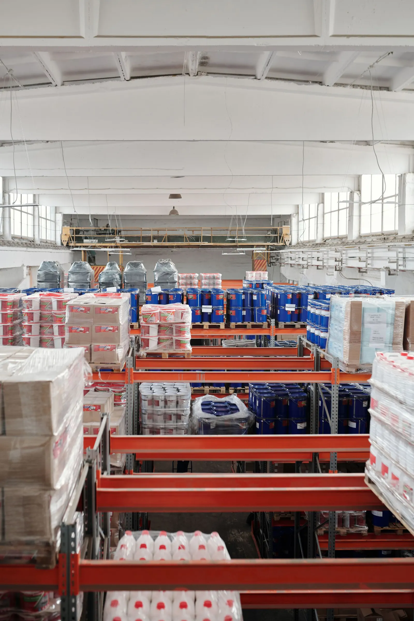 Packaged goods and consumables stacked on warehouse shelves